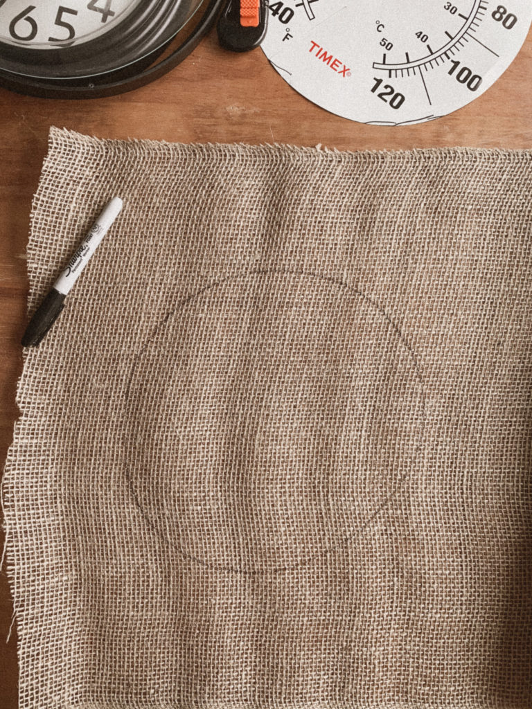 Traced template on burlap.