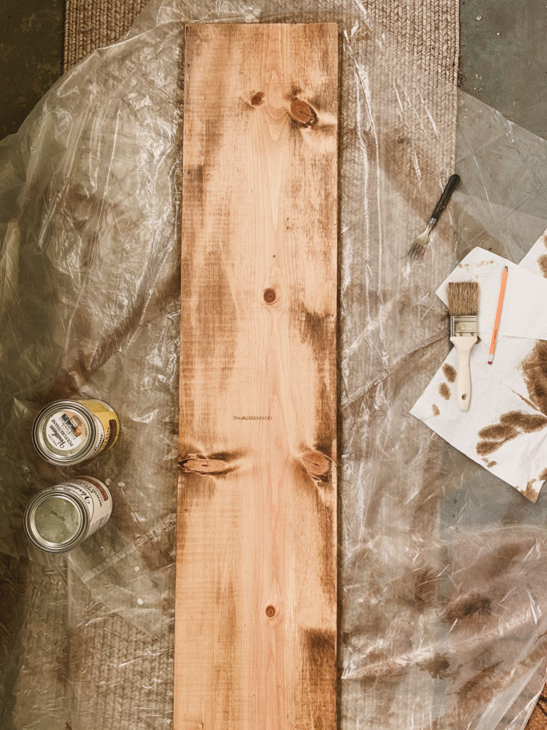 Piece of wood on the ground, now stained.