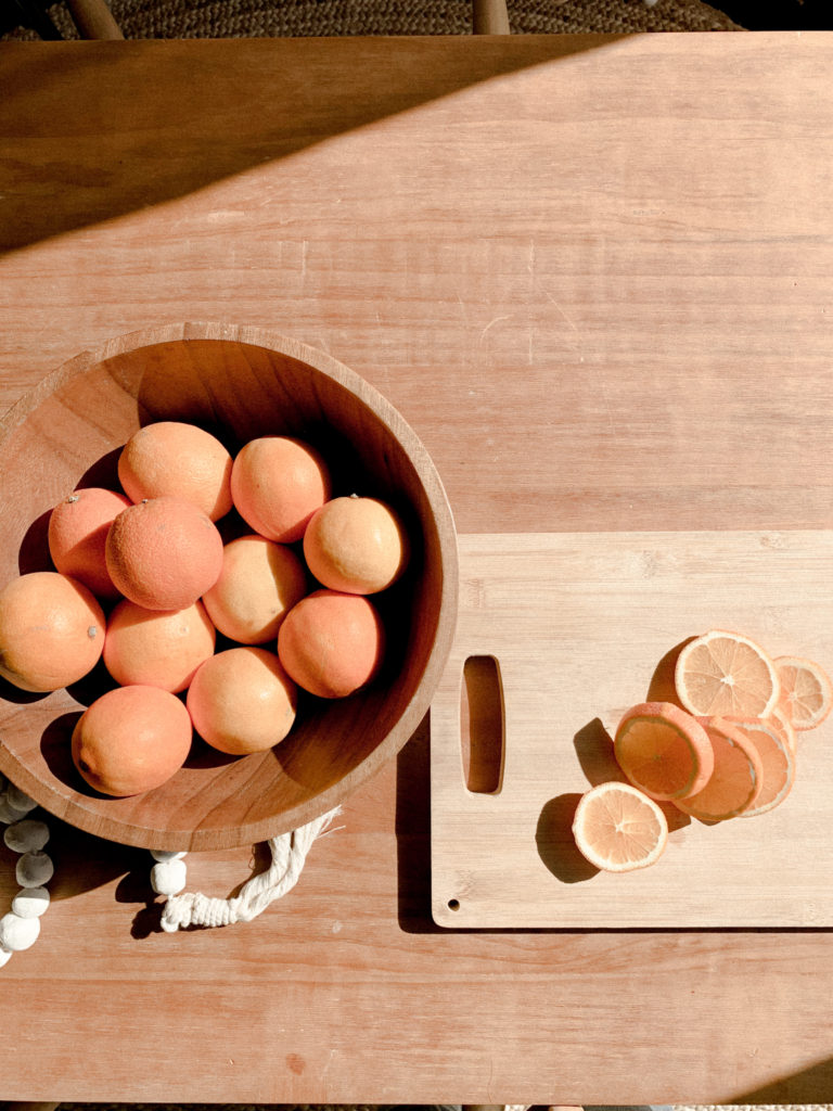 Overheard shot of orange slices on cutting board. 