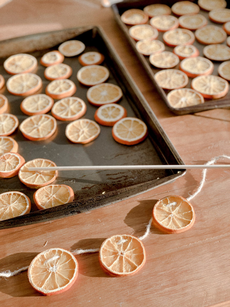 Orange garlands being assembled. 