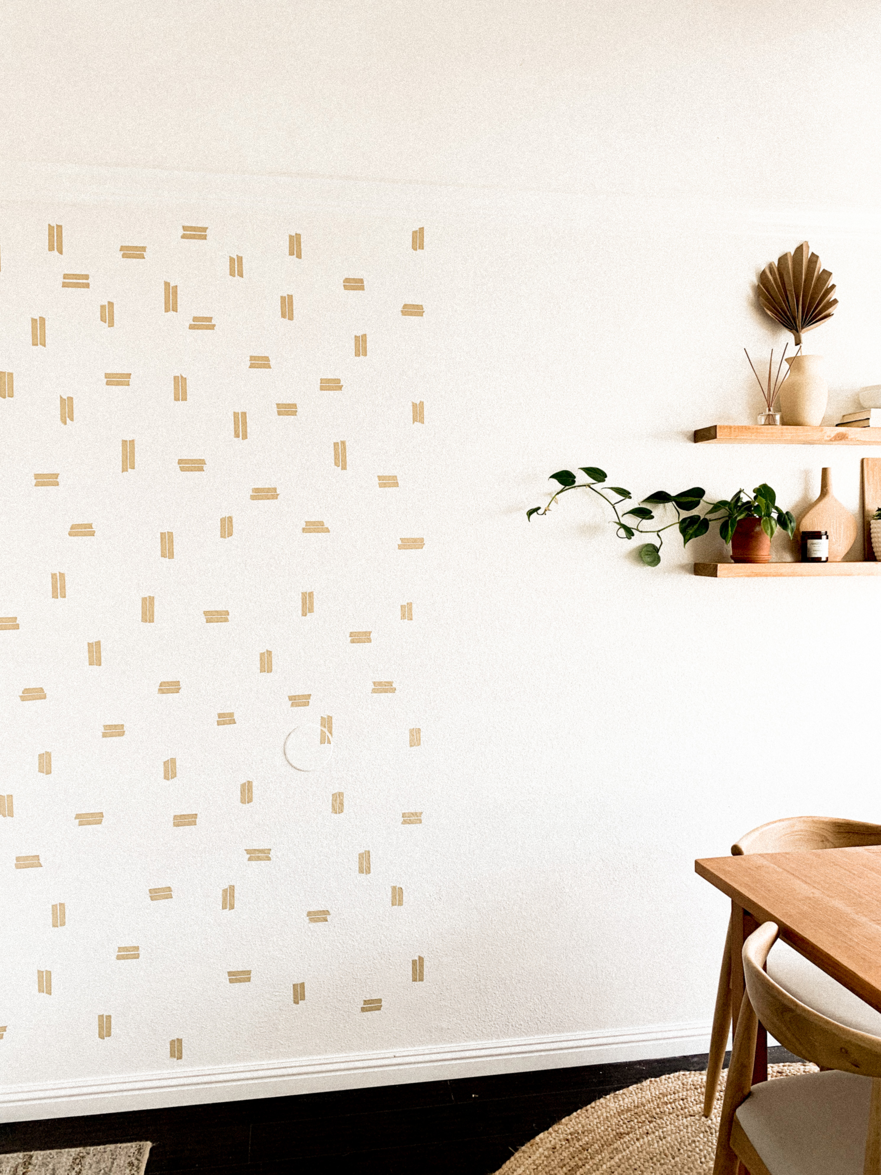 Medium shot of washi tape wall next to dining area. Washi tape walls help create separation and dimension.