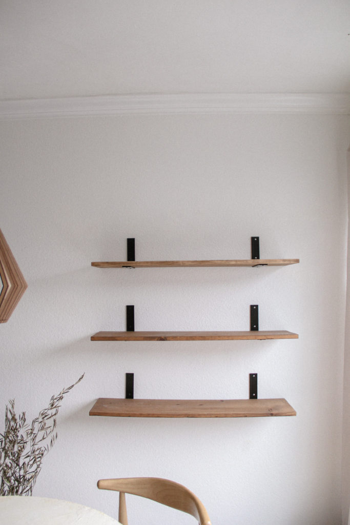 Style open shelves, starting with a blank slate. 